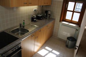 a kitchen with a sink and a counter top at Ferienwohnung Martin in Eschwege