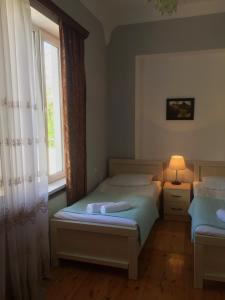Voodi või voodid majutusasutuse Holiday House toas
