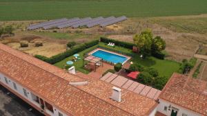 an aerial view of a house with a swimming pool at Quinta da Gafaria in Santarém