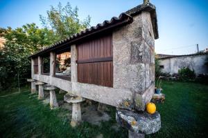 a small house on stools in a yard at Casa Vilar in Sanxenxo