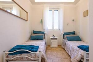 Postel nebo postele na pokoji v ubytování Casa Agata, accogliente appartamento nel centro storico