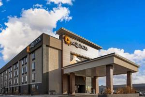 a building with a sunflower sign on top of it at La Quinta by Wyndham Denver Aurora Medical in Aurora