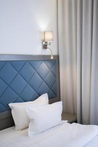 Postel nebo postele na pokoji v ubytování Spa-Hotel Myslyvskiy Dvir