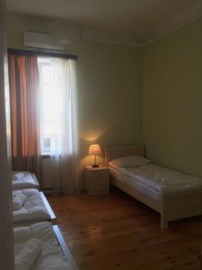 Voodi või voodid majutusasutuse Holiday House toas