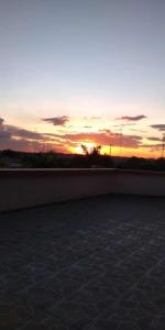 a sunset with the sun setting in the background at HOTEL AVENIDA in Alta Floresta