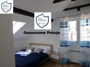 Postel nebo postele na pokoji v ubytování Orzechowa Przystań