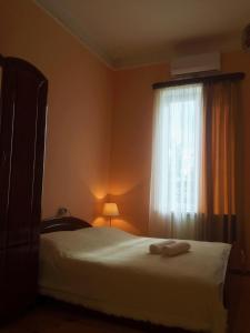 Voodi või voodid majutusasutuse Holiday House toas