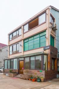 a tall brick building with a lot of windows at Nancy Guesthouse in Shanghai