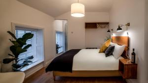 a bedroom with a bed and a window at Black Cat in Galway