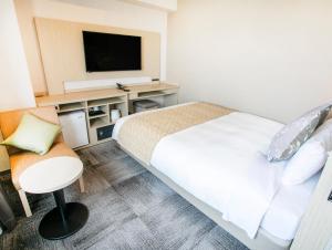 ART Hotel Oita客房内的一张或多张床位