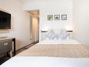 ART Hotel Oita客房内的一张或多张床位