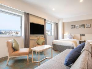 ART Hotel Oita客房内的一张或多张床位