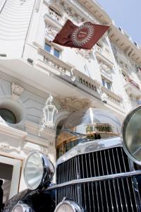 a car parked in front of a building at Boscolo Nice Hotel & Spa in Nice +136 photos