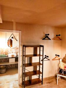 a room with a sink and a shelf with lights at Casa Francesca Altea piscina y aparcamiento privado in Altea