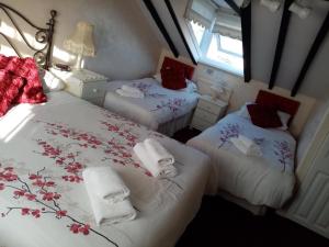 Ένα ή περισσότερα κρεβάτια σε δωμάτιο στο Fjaerland Hotel