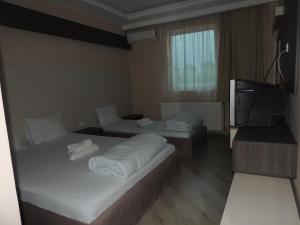 Un pat sau paturi într-o cameră la Guest House Dabi