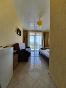 Postel nebo postele na pokoji v ubytování GRANAT Hotel