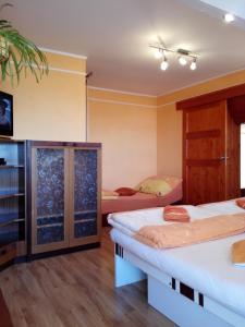 A bed or beds in a room at Apartmán Slnečnica