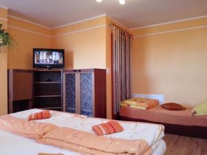 Tempat tidur dalam kamar di Apartmán Slnečnica