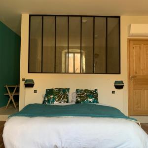 a bedroom with a bed with a window above it at CASA CITADELLA Bonifacio in Bonifacio +25 photos