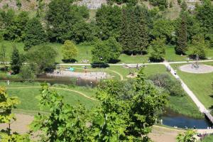 an aerial view of a park with a pond and trees at Albglück in Gammertingen