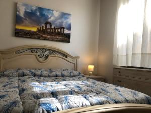 מיטה או מיטות בחדר ב-Le stanze dell'Olimpo