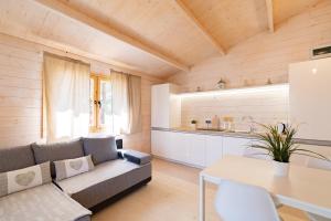 a living room with a couch and a table at Marina Holiday in Ustka