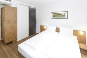 Tempat tidur dalam kamar di Hotel Wirtshaus Garbe