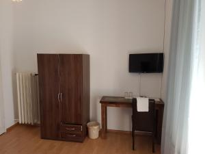 TV a/nebo společenská místnost v ubytování Bottega del Vino Guesthouse