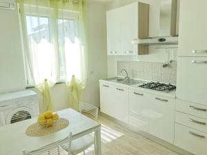 Kuchyň nebo kuchyňský kout v ubytování B&B Villa Rosa