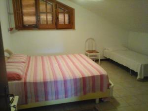 a bedroom with a bed and a couch in it at B&B Tio Pepe in Roseto degli Abruzzi