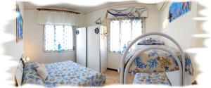Posteľ alebo postele v izbe v ubytovaní Casa Vacanza Marina, in pieno centro a pochi passi dal mare e con aria condizionata!
