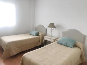 Posteľ alebo postele v izbe v ubytovaní Apartamento Rialto