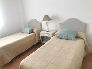 Posteľ alebo postele v izbe v ubytovaní Apartamento Rialto