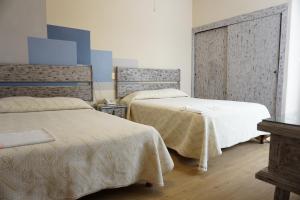 1 dormitorio con 2 camas en una habitación en Hotel Palacio, en Xalapa