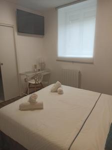 Łóżko lub łóżka w pokoju w obiekcie Rin Rooms