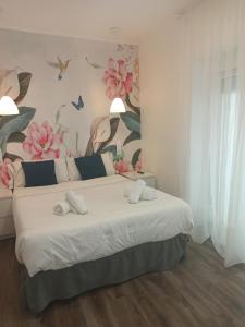 Łóżko lub łóżka w pokoju w obiekcie Rin Rooms