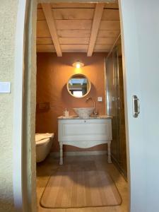 a bathroom with a sink and a toilet at ZEVKLİLER ALAÇATI hotel in Alacati +178 photos