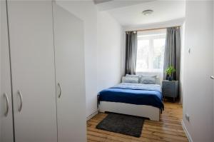 Posteľ alebo postele v izbe v ubytovaní Apartament Viktoria