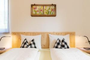 Posteľ alebo postele v izbe v ubytovaní Spitalerhof Apartment & Sauna