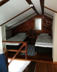 a room with two bunk beds in a house at Kirkkokadun Amanda ja Olga in Uusikaupunki