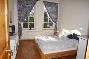 Postel nebo postele na pokoji v ubytování Auberge Tabarz Zimmerberg
