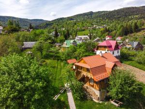 an aerial view of a house with an orange roof at Садиба "Три Царі" in Yaremche