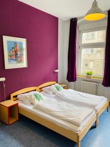 Postel nebo postele na pokoji v ubytování Happy Hotel Berlin + 37 fotografií