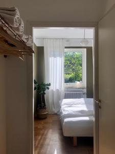 Postel nebo postele na pokoji v ubytování HEMMET Simrishamns vandrarhem och B&B