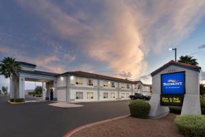 a large building with a sign in front of it at Baymont by Wyndham Casa Grande in Casa Grande