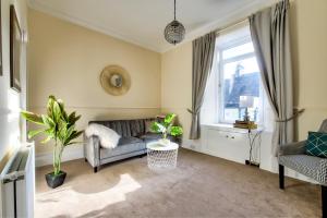 Ένα ή περισσότερα κρεβάτια σε δωμάτιο στο Oaktree Appartment Moffat