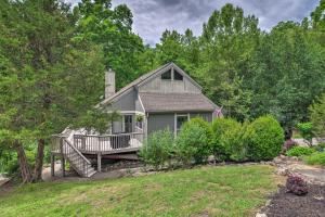 a gray house with a porch and a deck at Gated Resort Home Norris Lake Access, Shared Dock in La Follette