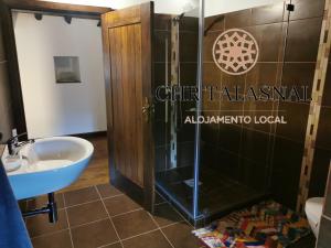 a bathroom with a shower and a sink at CHR Talasnal in Lousã