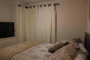 Postel nebo postele na pokoji v ubytování habitac privada Bed n Bkf Patagonia Norte - Puerto Varas Homestay - BnB Plus